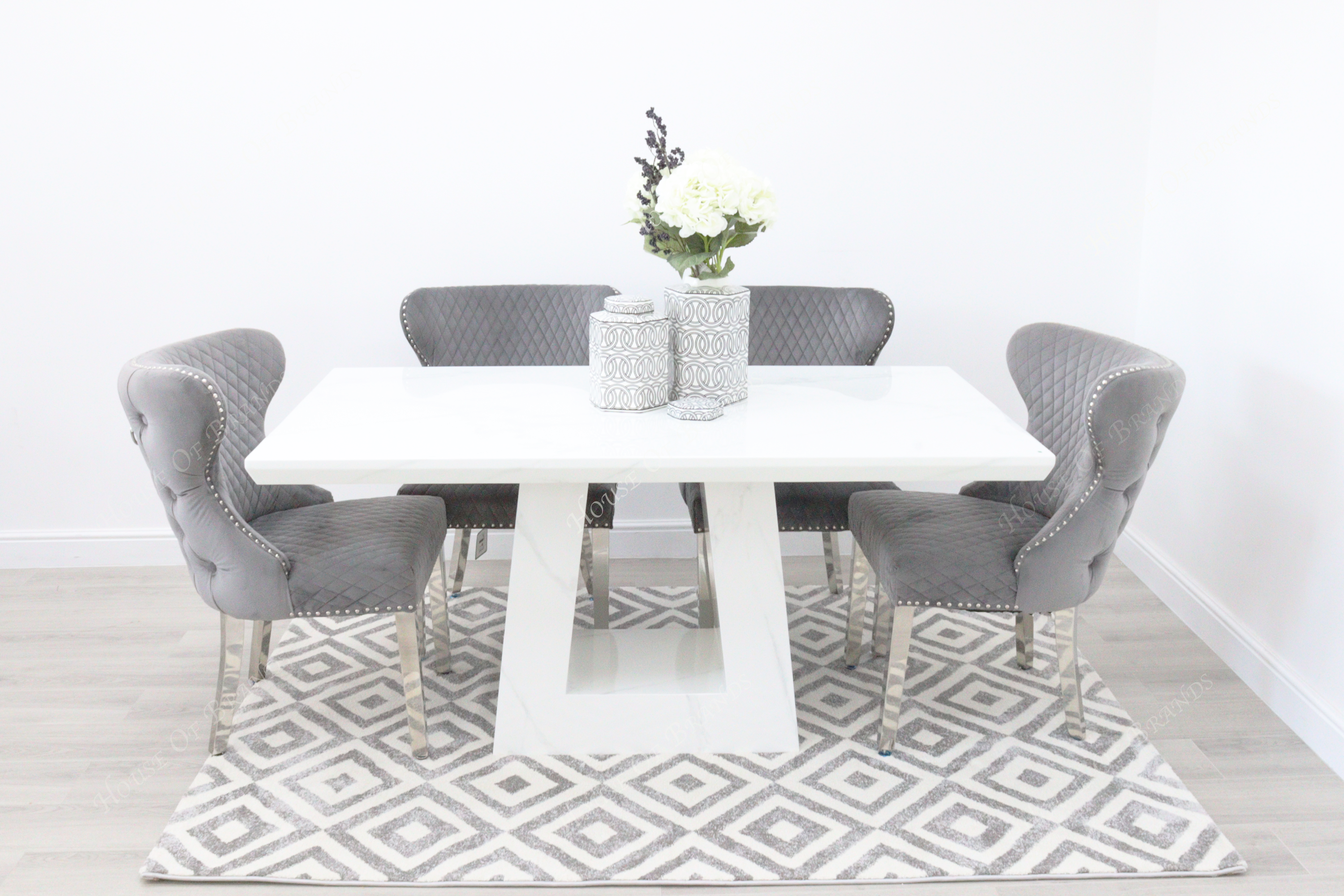 Rio White Marble Dining Table with 4 Valentino Velvet Knockerback Dining Chairs