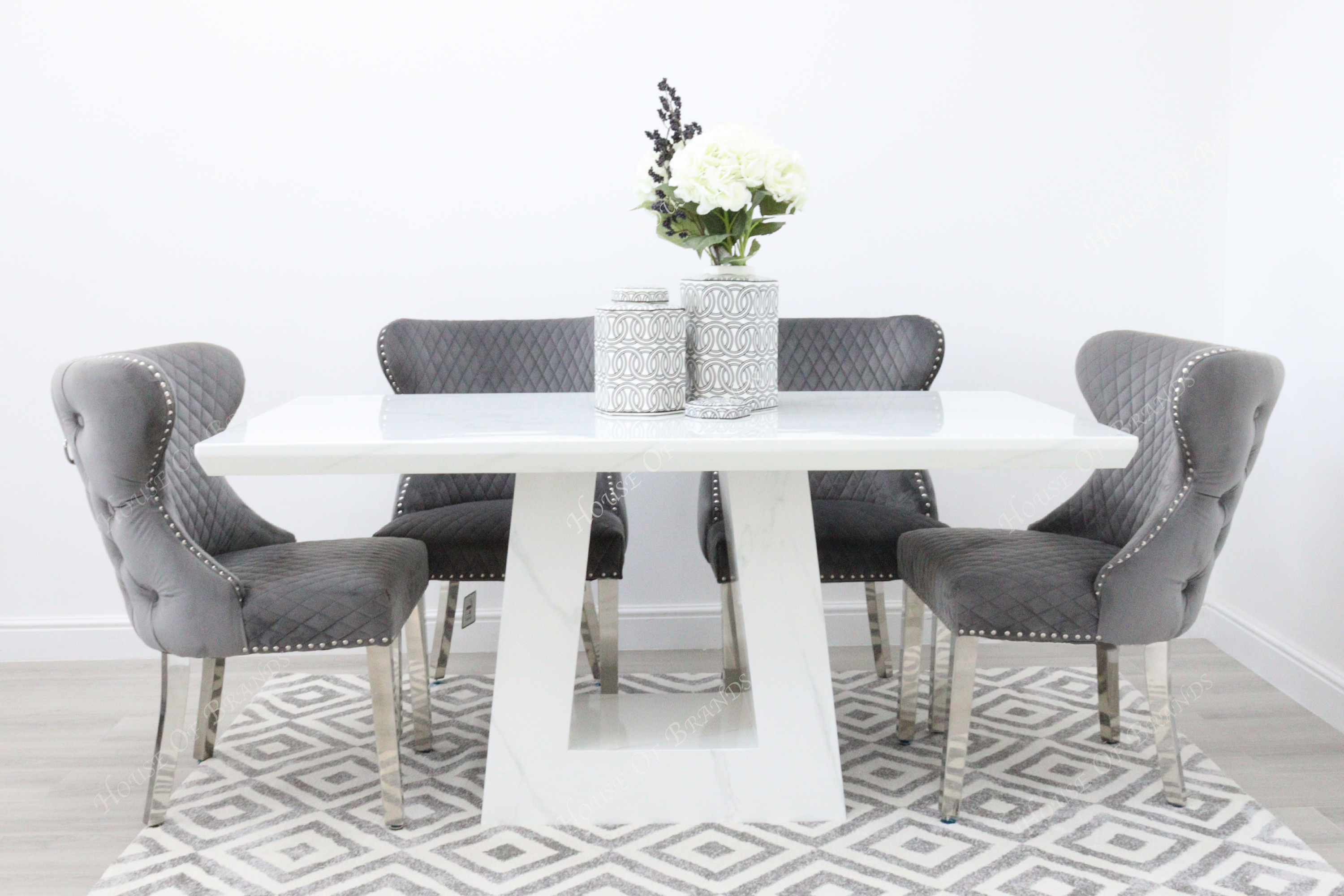 Rio White Marble Dining Table with 4 Valentino Velvet Knockerback Dining Chairs