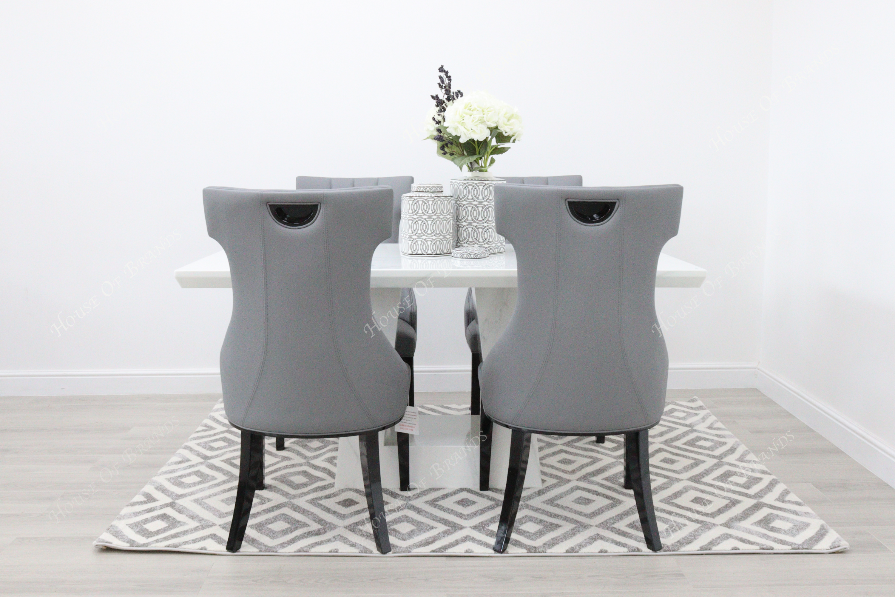 Rio White Marble Dining Table with 4 Tremiti Grey Leather Dining Chairs