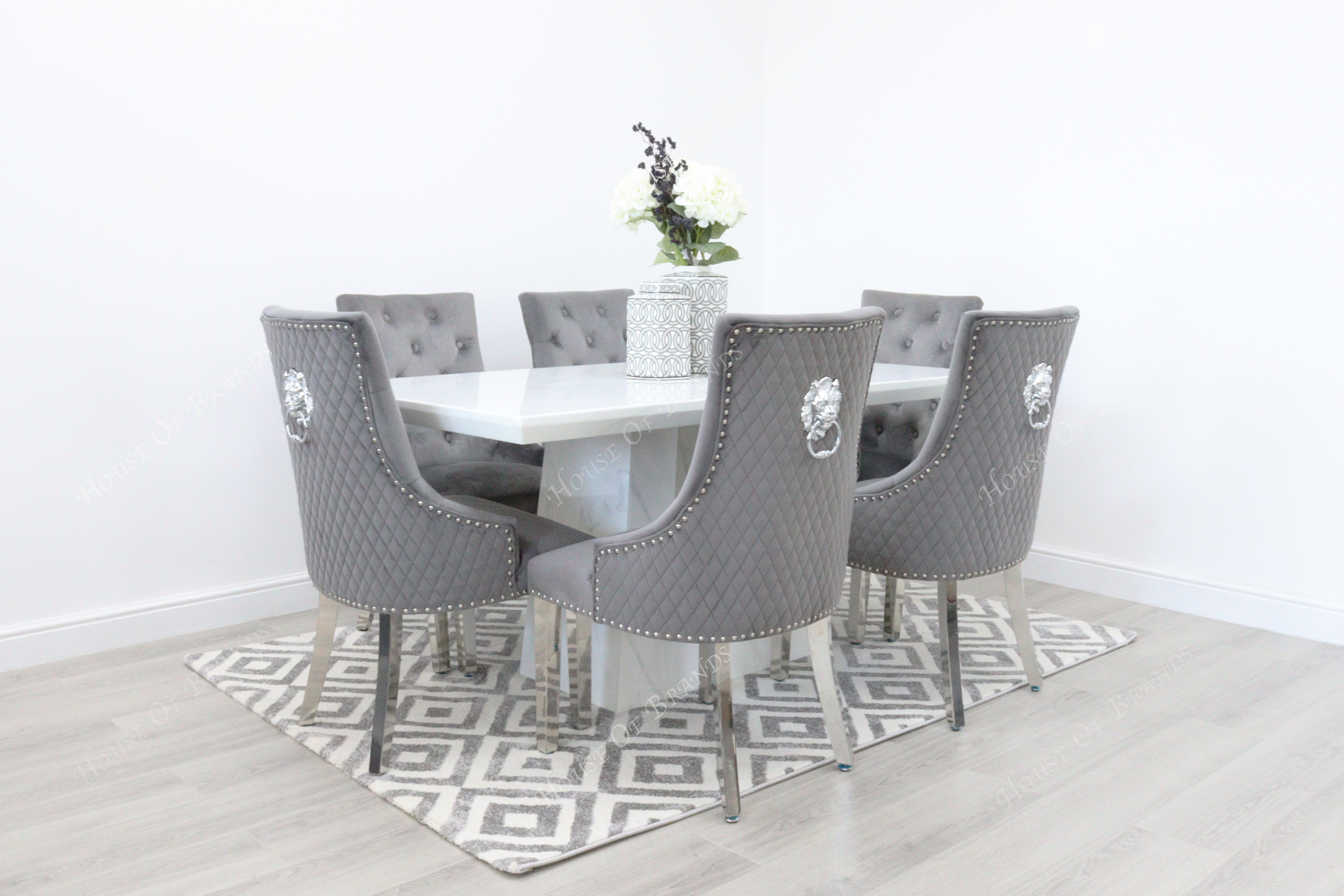 Rio White Marble Dining Table with 6 Majestic Knockerback Velvet Dining Chairs