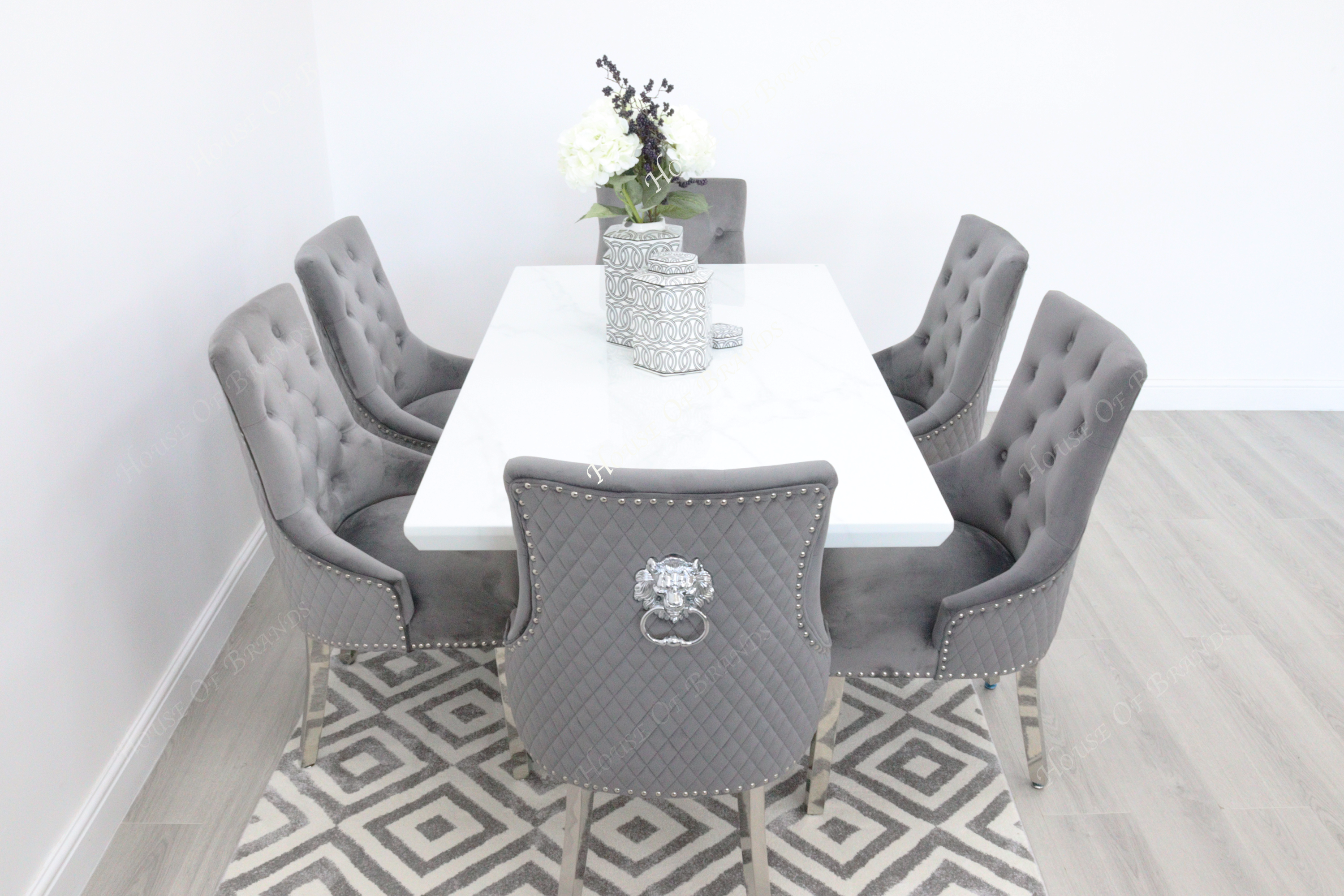 Rio White Marble Dining Table with 6 Majestic Knockerback Velvet Dining Chairs