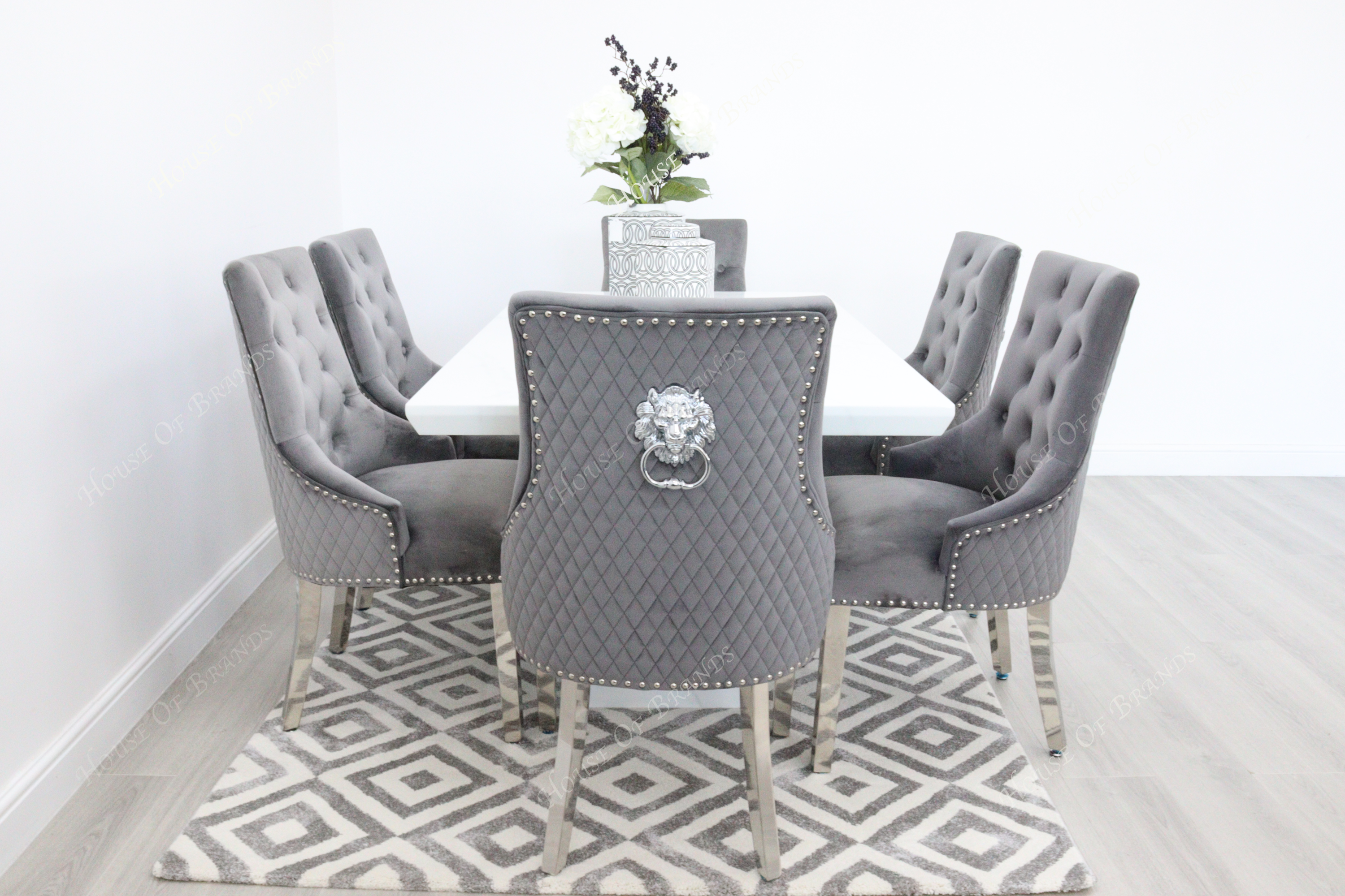 Rio White Marble Dining Table with 6 Majestic Knockerback Velvet Dining Chairs