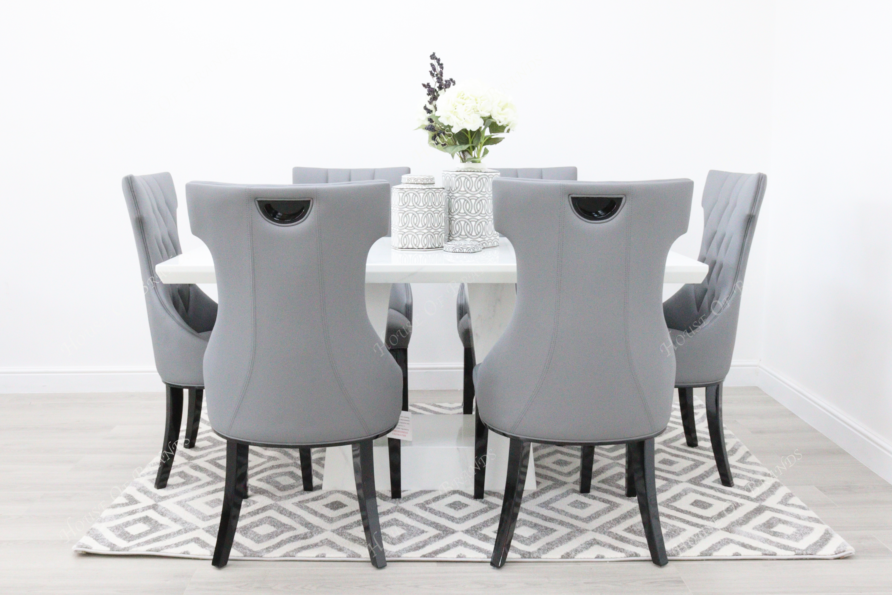 Rio White Marble Dining Table with 6 Tremiti Grey Leather Dining Chairs