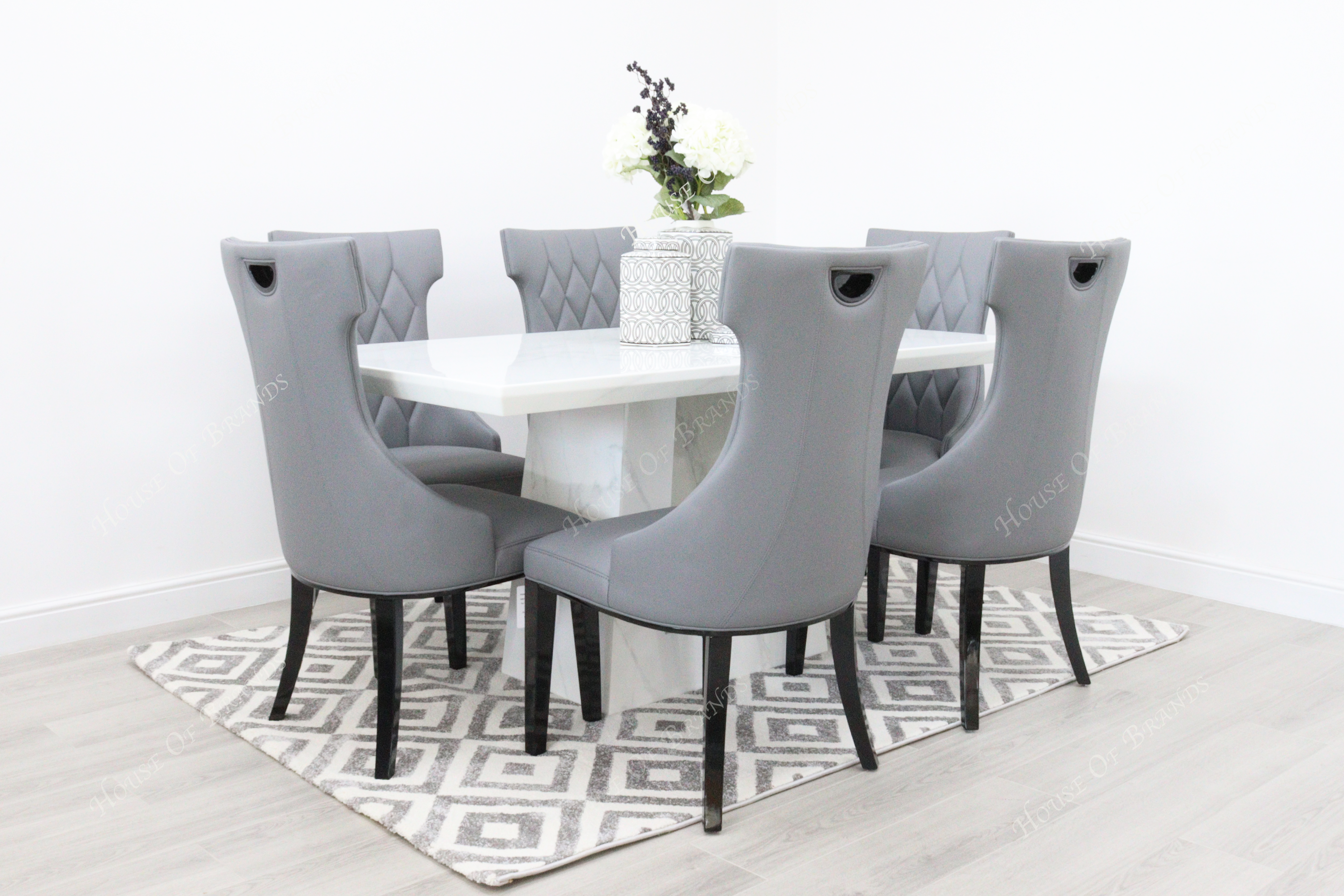 Rio White Marble Dining Table with 6 Tremiti Grey Leather Dining Chairs
