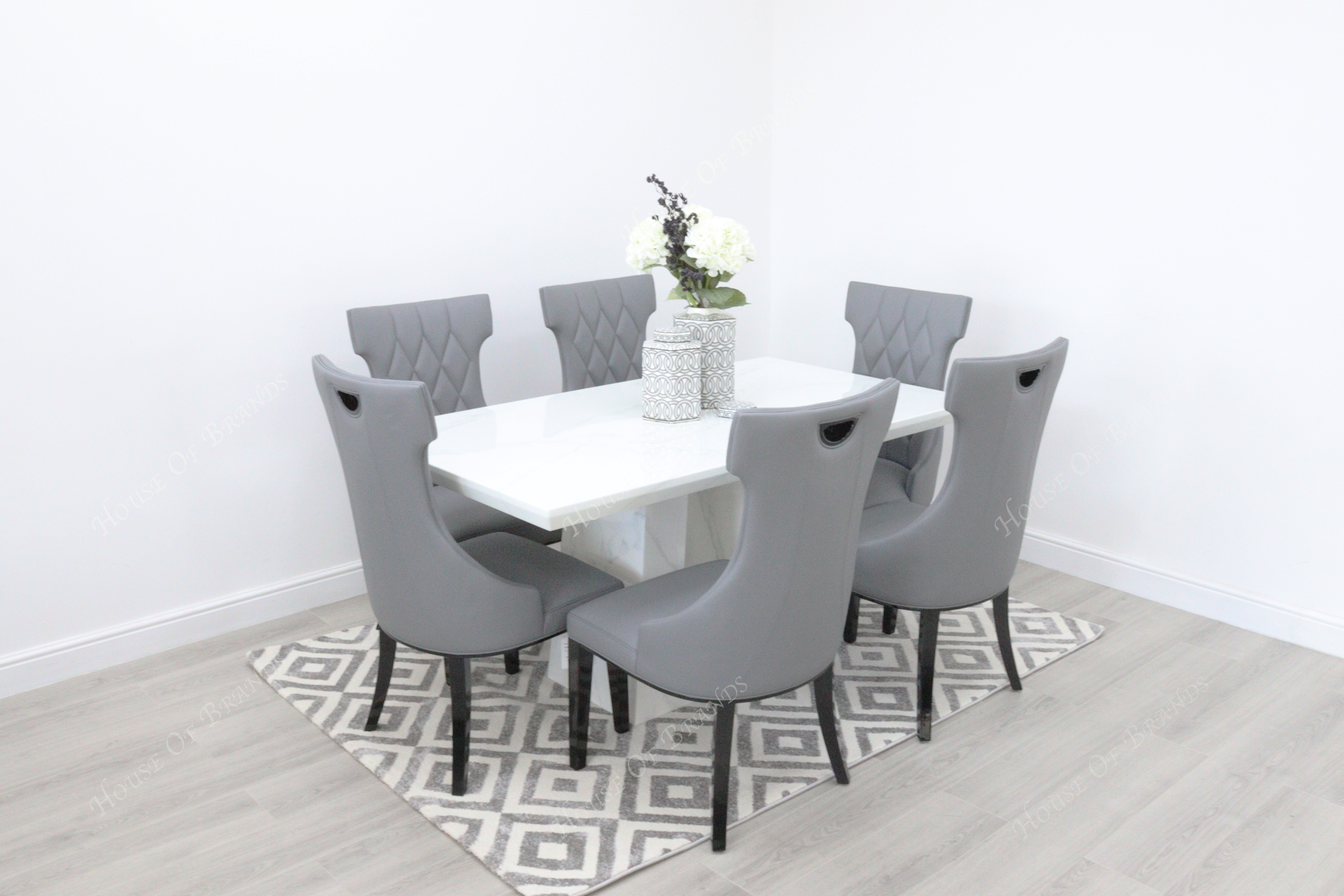 Rio White Marble Dining Table with 6 Tremiti Grey Leather Dining Chairs