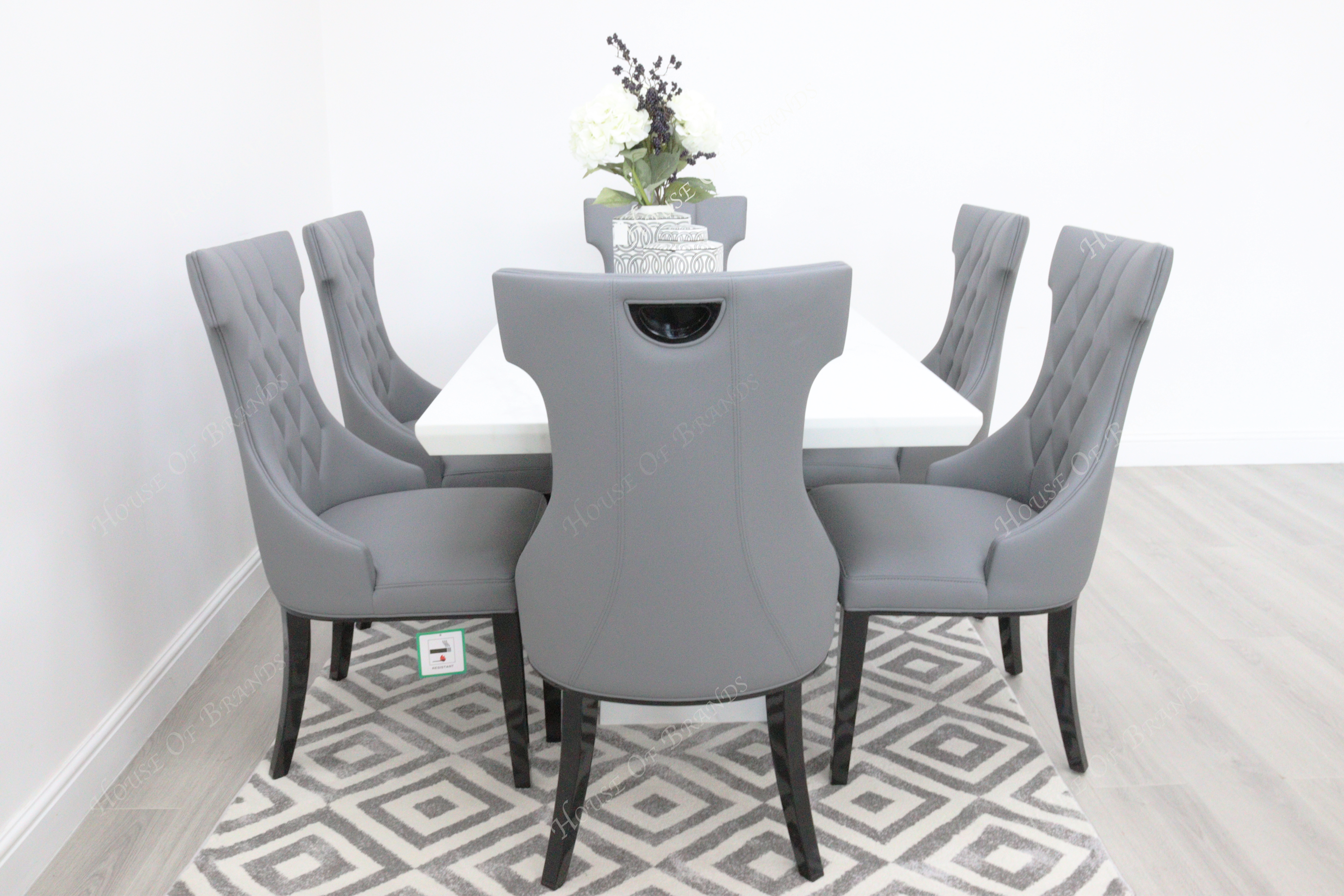 Rio White Marble Dining Table with 6 Tremiti Grey Leather Dining Chairs